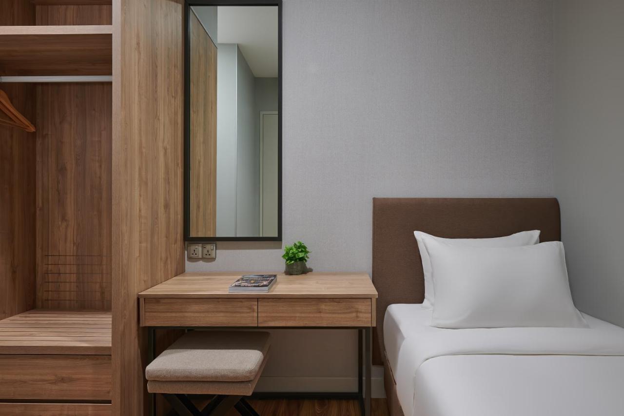 Mercure Living ปุตราจายา ภายนอก รูปภาพ A bedroom at the hotel
