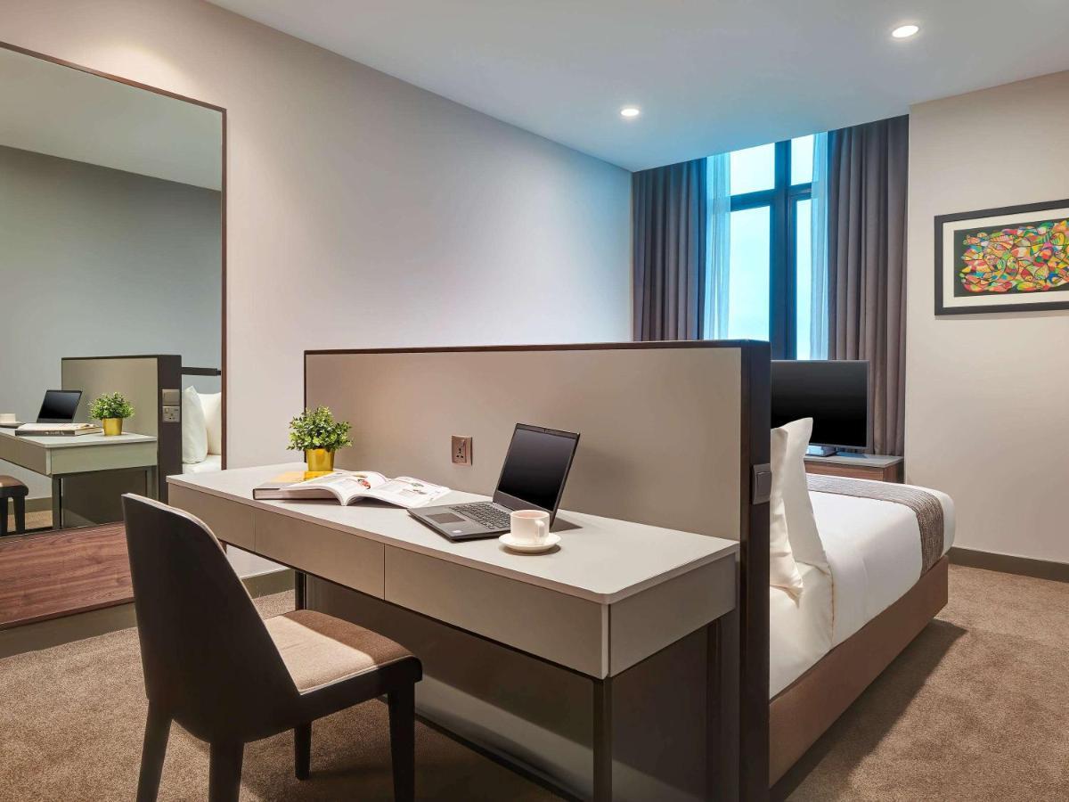 Mercure Living ปุตราจายา ภายนอก รูปภาพ A bedroom at the hotel